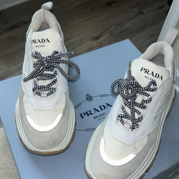 Prada sneakers It has a couple of little spots on it that’s cleanable. - Picture 11 of 12